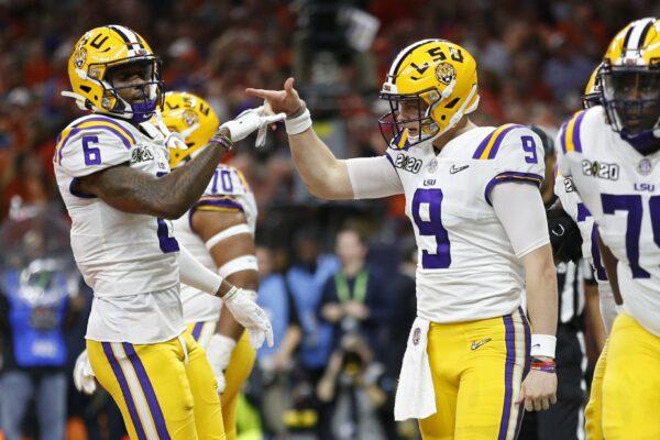 LSU quarterback Joe Burrow, right, celebrates with wide receiver Terrace Marshall Jr. after scoring against Clemson during the first half of a NCAA College Football Playoff national championship game on Jan. 13, 2020, in New Orleans. (Gerald Herbert/AP Photo)