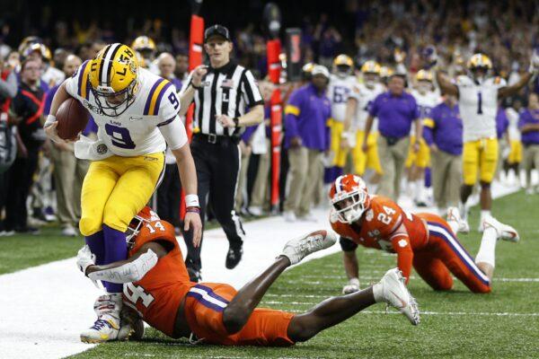 LSU quarterback Joe Burrow is tackled by LSU defensive back Maurice Hampton Jr. during the first half of a NCAA College Football Playoff national championship game on Jan. 13, 2020, in New Orleans. (Gerald Herbert/AP Photo)