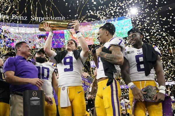 LSU quarterback Joe Burrow holds the trophy after their win against Clemson in a NCAA College Football Playoff national championship game on Jan. 13, 2020, in New Orleans. LSU won 42-25. (David J. Phillip/AP Photo)