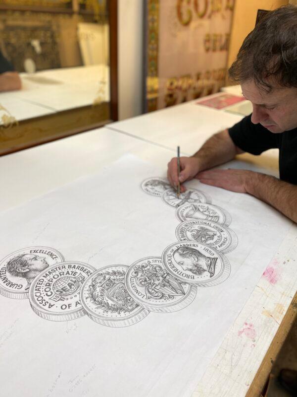 David Adrian Smith draws part of the design for a reverse glass painting commissioned by Ludlow Blunt in Brooklyn, N.Y. (Courtesy of David A. Smith)