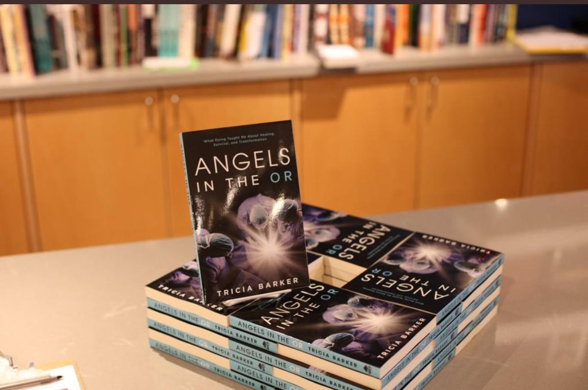 Copies of Tricia Barker's book "Angels in the OR: What Dying Taught Me About Healing, Survival, and Transformation." (Courtesy of Tricia Barker)