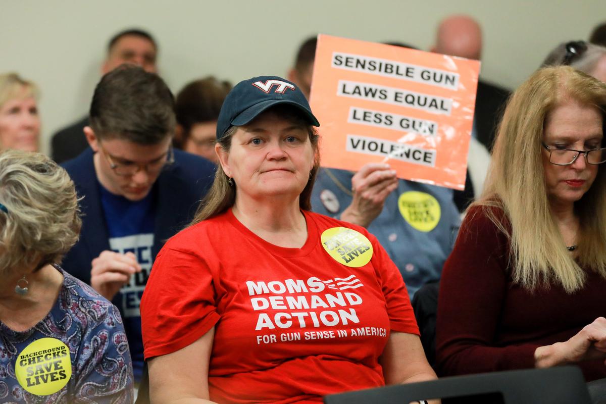 Gun control advocates attend a hearing where four gun control bills passed the Senate Judiciary Committee at the Virginia State Capitol in Richmond on Jan. 13, 2020. (Samira Bouaou/The Epoch Times)