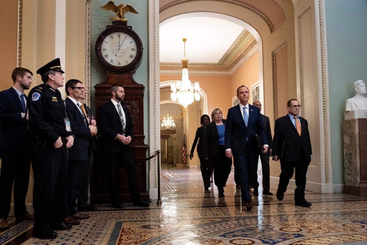 House managers, led by Chairman of the House Intelligence Committee Adam Schiff (2nd R) and Chairman of the House Judiciary Committee Jerry Nadler (R) walk to the Senate on Jan. 16, 2020, to deliver the Articles of Impeachment against President Donald Trump, at the Capitol in Washington. (Brendan Smialowski/AFP via Getty Images)