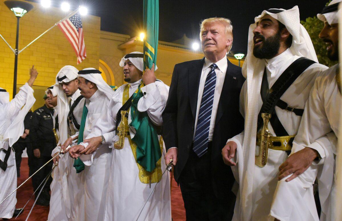 President Donald Trump joins dancers with swords during a ceremony ahead of a banquet at the Murabba Palace in Riyadh on May 20, 2017.  (Mandel Ngan/AFP via Getty Images)