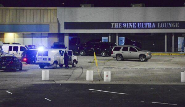 Kansas City, Mo., police crime scene investigators gather evidence at the scene of a shooting at a nightclub in Kansas City, Mo., in the early hours of Jan. 20, 2020. (Luke Nozicka/The Kansas City Star via AP)tex