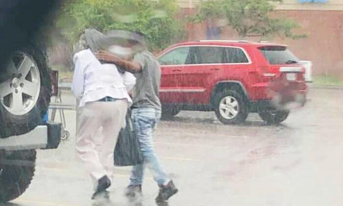 Cop Sees Black Teen Protecting Senior White Woman From the Rain With Jacket–so He Buys Him Dinner