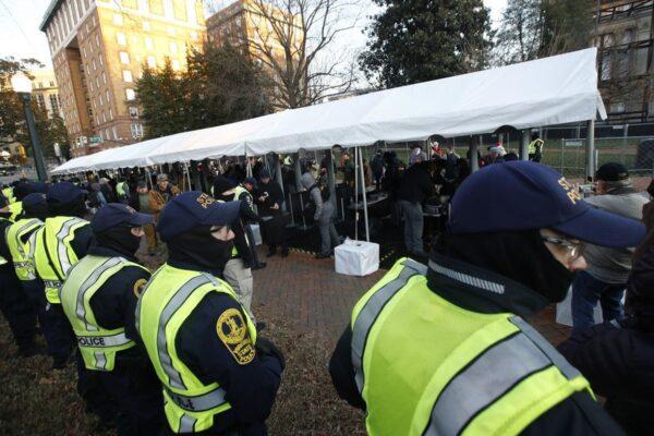 Virginia State police troopers stand near a security checkpoint before demonstrators enter the capitol grounds ahead of a pro-gun rally in Richmond, Virginia, on Jan. 20, 2020 (Steve Helber/AP Photo)