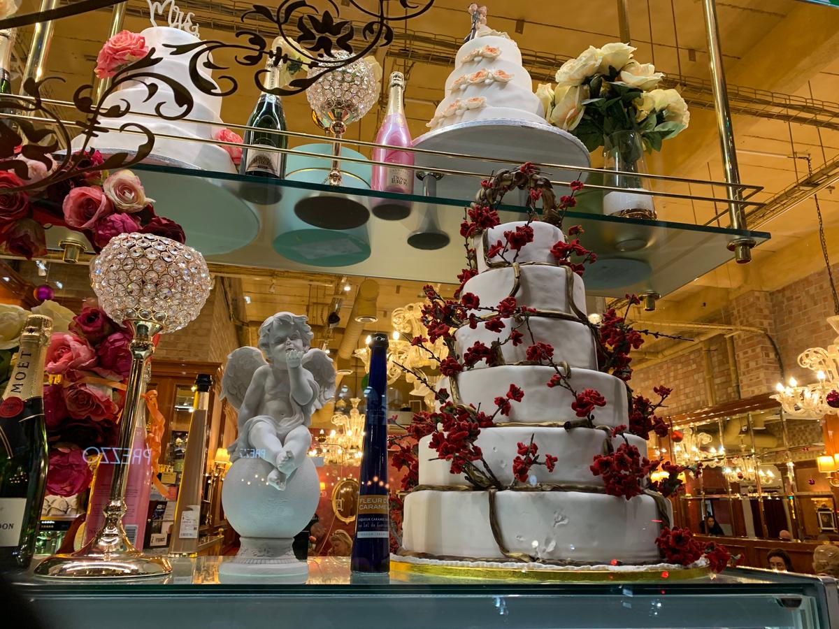 Every window offers temptations during the holidays—such as fine cakes and bubbly like the one here. (Lisa Sim)
