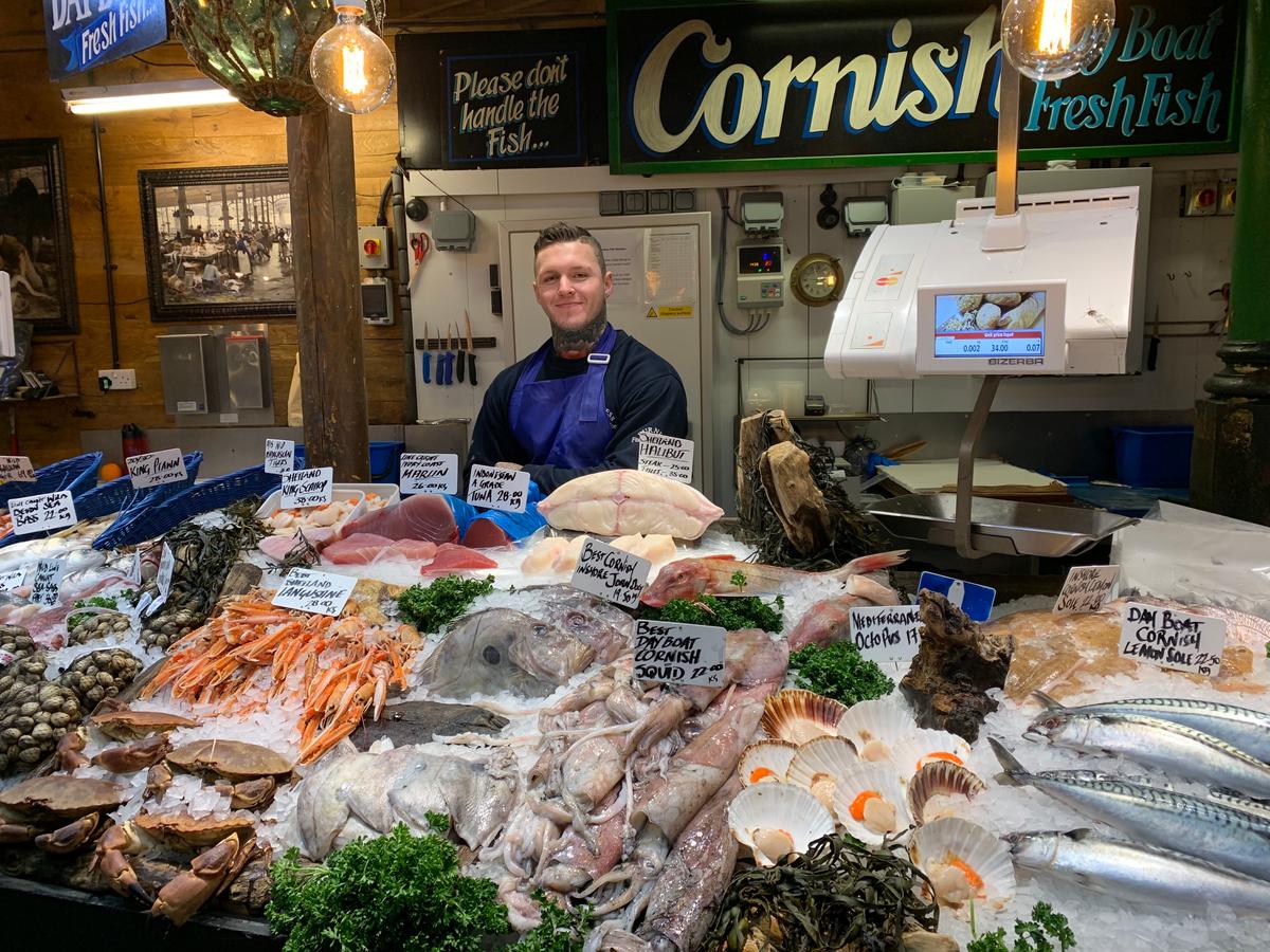 A proud fishmonger displays his bounty of seafood. Lovely cooked mussels served up with a big chunk of freshly baked bread makes this stop a must. (Lisa Sim)