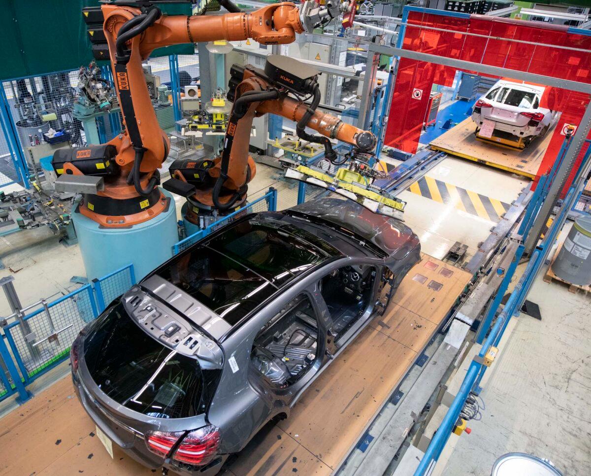 A robot mounts a windshield on a Mercedes Benz A Class on the assembly line at the Daimler AG factory in Rastatt, Germany, on Feb. 4, 2019. (Thomas Kienzle/AFP via Getty Images)