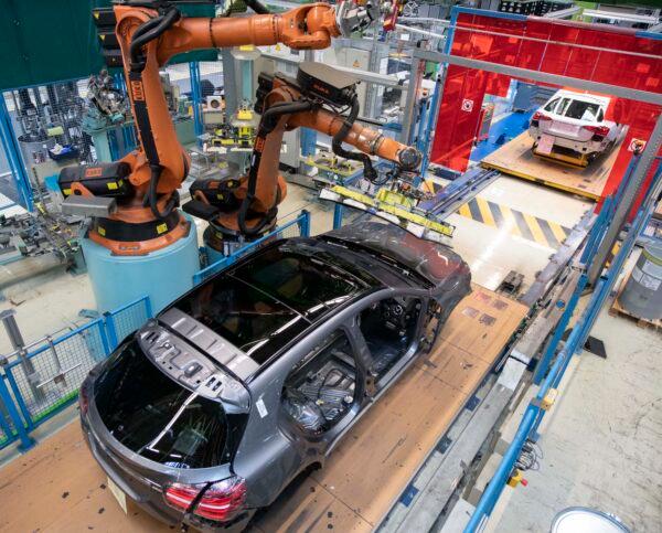 A robot mounts a windshield on a Mercedes Benz A-Class on the assembly line at the Daimler AG factory in Rastatt, Germany, on Feb. 4, 2019. (Thomas Kienzle/AFP via Getty Images)