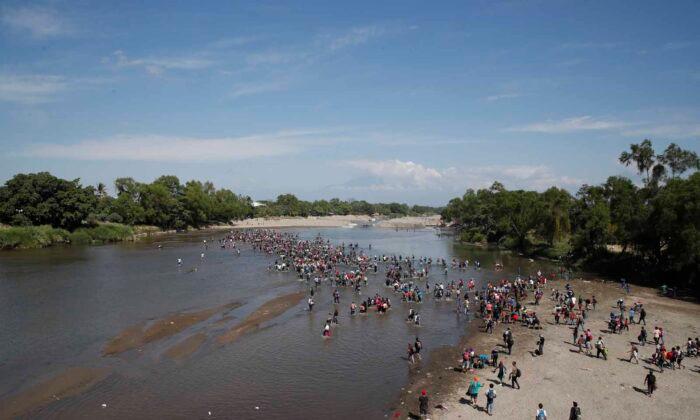 Migrants Scuffle With Mexican Troops Along Border River