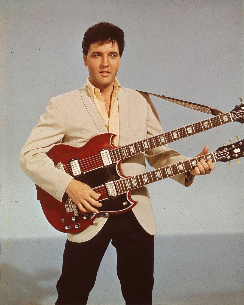 Singer and actor Elvis Presley (1935–1977) playing a Gibson guitar in his 1966 film, "Spinout" (Hulton Archive/Getty Images)