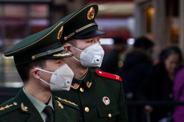 Chinese police officers wear protective masks at Beijing Station in Beijing, China on Jan. 22, 2020. (Kevin Frayer/Getty Images)