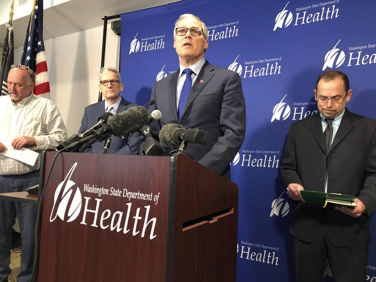 Washington Gov. Jay Inslee (C) speaks at a news conference in Shoreline, Wash., on Jan. 21, 2020, following the announcement that a man in Washington state is the first known person in the United States to catch a new type of coronavirus that officials believe originated in China. (Carla K. Johnson/AP Photo)