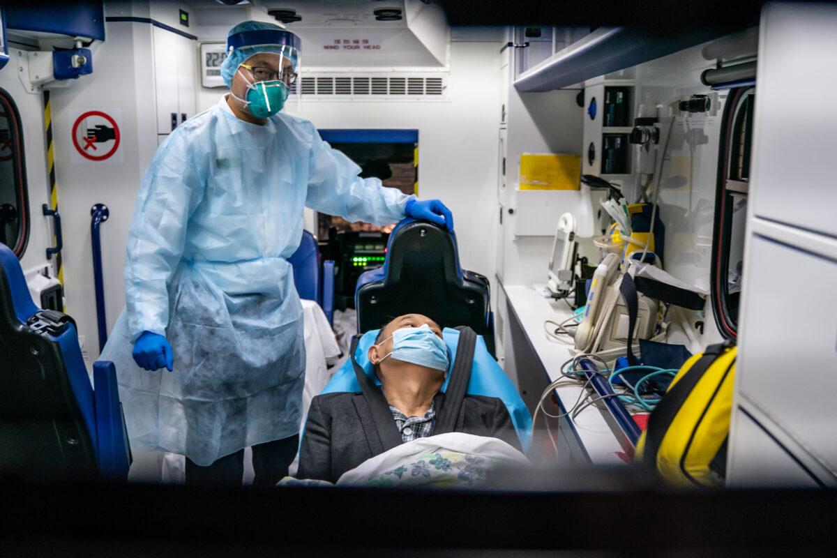 A patient is transferred by an ambulance to the Infectious Disease Centre of Princess Margaret Hospital in Hong Kong on Jan. 22, 2020. (Anthony Kwan/Getty Images)