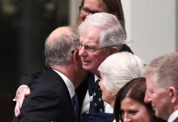 Then-treasurer Scott Morrison receives a hug from his father at Parliament House in Canberra, Australia, on May 3, 2016. (Stefan Postles/Getty Images)