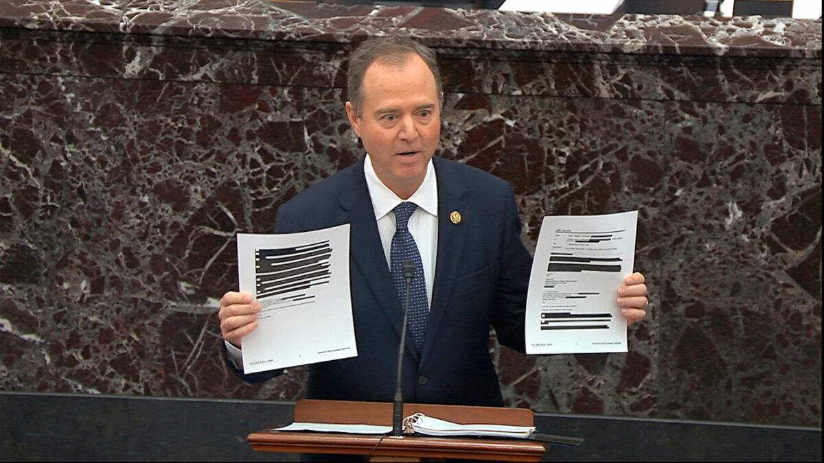 In this image from video, House impeachment manager Adam Schiff (D-Calif.) holds redacted documents as he speaks during the impeachment trial against President Donald Trump in the Senate at the U.S. Capitol in Washington on Jan. 22, 2020. (Senate Television via AP)