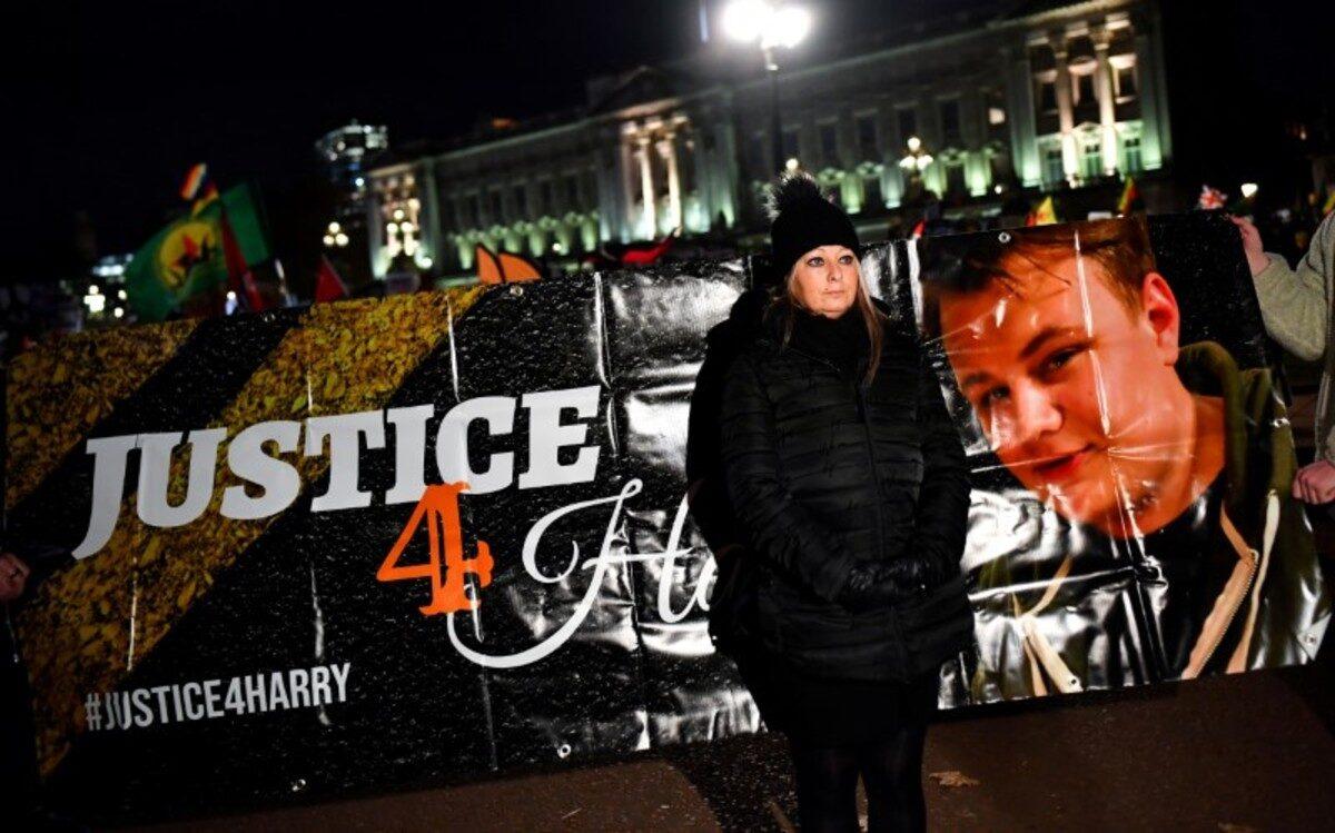 Harry Dunn’s mother Charlotte Charles poses in front of a banner outside the Buckingham Palace, London, on Dec. 3, 2019. (Dylan Martinez/Reuters)