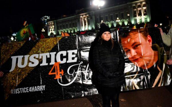 Harry Dunn’s mother Charlotte Charles poses in front of a banner outside the Buckingham Palace, London, England, on Dec. 3, 2019. (Dylan Martinez/Reuters)