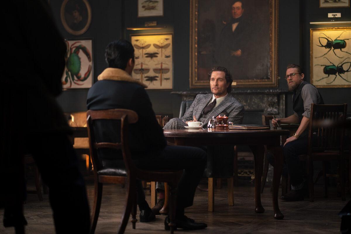 (L<strong>–</strong>R) Henry Golding, Matthew McConaughey, and Charlie Hunnam star in Guy Ritchie's “The Gentlemen.” (Christopher Raphael/STX Films)