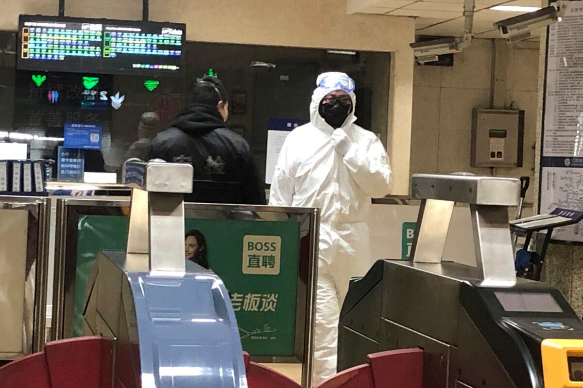 A security officer wears a hazardous materials suit at a subway station in Beijing, China amid the Wuhan coronavirus outbreak on Jan. 24, 2020. (Yunan Wang/AP Photo)