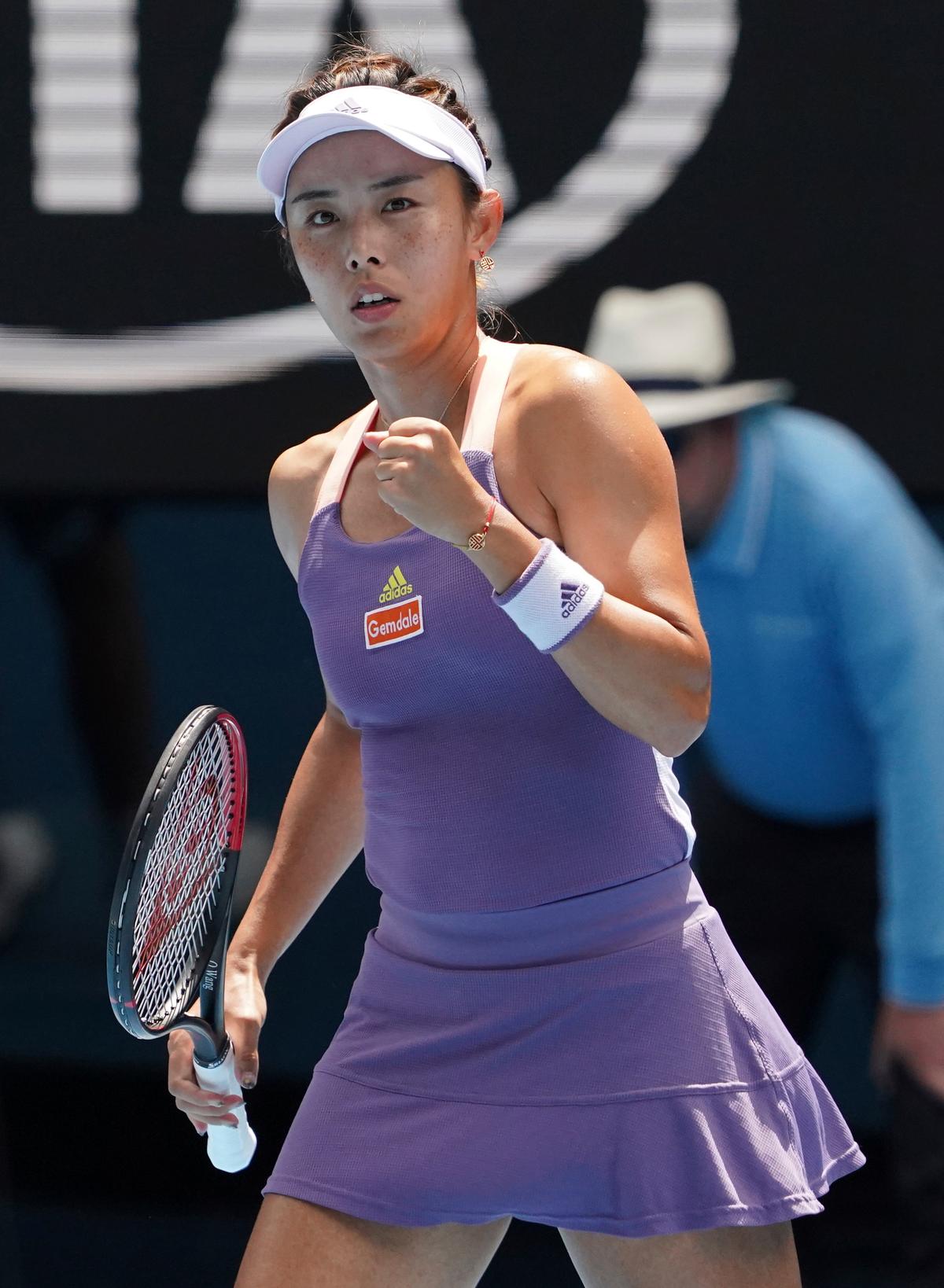 China's Wang Qiang reacts as she plays against Serena Williams of the U.S. in their third round singles match at the Australian Open tennis championship in Melbourne, Australia, Friday, Jan. 24, 2020. (AP Photo/Lee Jin-man)