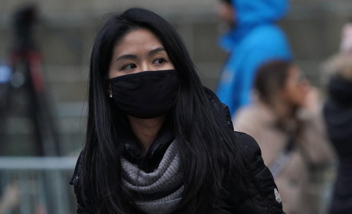 A woman wears a protective mask near the Chinatown section of New York City on Jan. 23, 2020, amid a growing number of cases worldwide of the Wuhan coronavirus. (Timothy A. Clary/AFP via Getty Images)