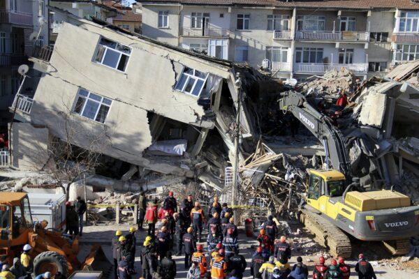Rescuers searching for people buried under the rubble of a collapsed building, after an earthquake struck Elazig, eastern Turkey on Jan. 25, 2020. (IHH/ Humanitarian Relief Foundation via AP)