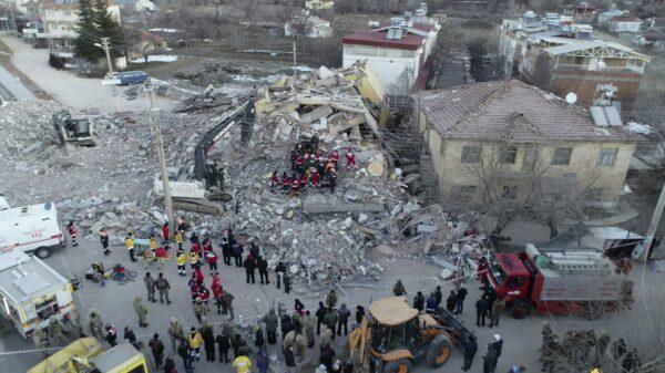 Rescuers work on a collapsed building after a strong earthquake struck in Elazig in the eastern Turkey on Jan. 25, 2020. (IHA via AP)