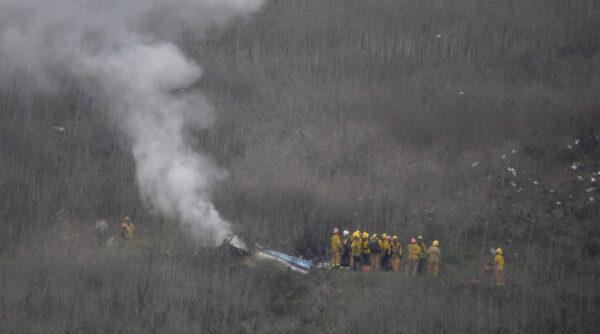Los Angeles firefighters on the scene of a helicopter crash that reportedly killed Kobe Bryant in Calabasas, Calif., on Jan. 26, 2020. (Gene Blevins/Reuters)