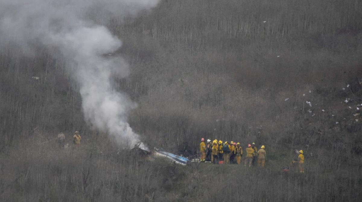 LA county firefighters on the scene of a helicopter crash that reportedly killed Kobe Bryant in Calabasas, Calif., on Jan. 26, 2020. (Gene Blevins/Reuters)