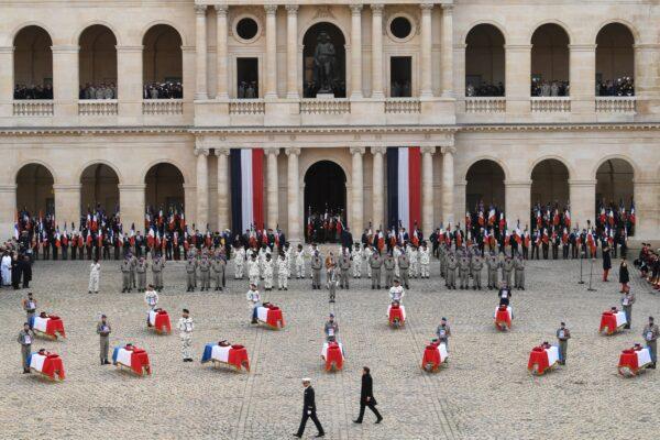 French President Emmanuel Macron attends a tribute ceremony at the Invalides monument for the 13 French soldiers killed in Mali, in Paris, France, on Dec. 2, 2019. (Eric Feferberg/AFP via Getty Images)