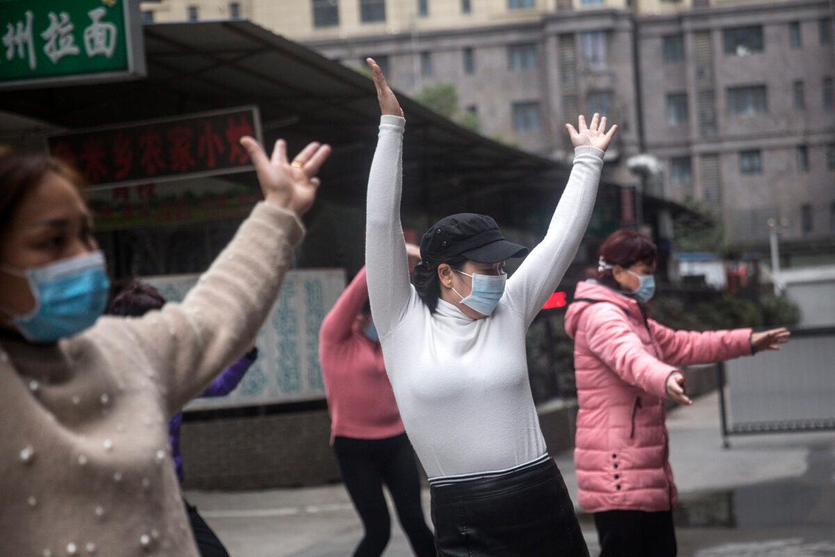 A group of women wear protective masks while exercising in Wuhan, China, on Jan. 27, 2020. (Getty Images)