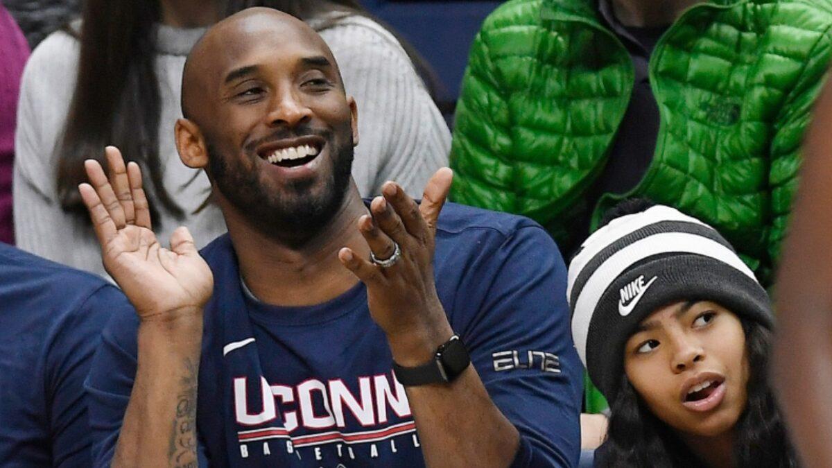 Kobe Bryant and his daughter Gianna watch the first half of an NCAA college basketball game between Connecticut and Houston in Storrs, Conn, on March 2, 2019. (Jessica Hill/AP Photo)