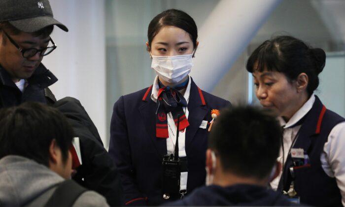 US Considers Expanding Screening of Airline Passengers for New Virus From China