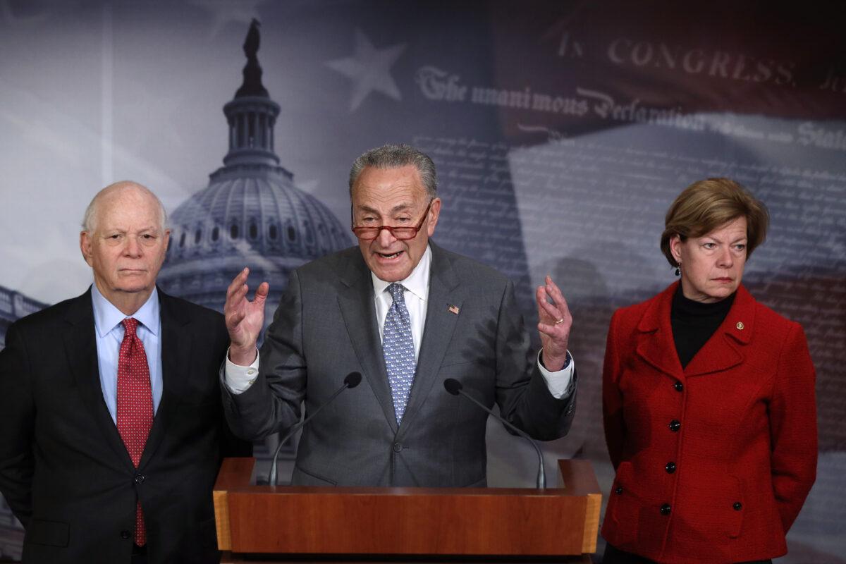 Senate Minority Leader Chuck Schumer (D-N.Y.) calls for senators to vote to subpoena former National Security Adviser John Bolton as Sen. Ben Cardin (D-Md.) (L) and Sen. Tammy Baldwin (D-Wis.) listen during a news conference at the U.S. Capitol in Washington on Jan. 27, 2020. (Alex Wong/Getty Images)