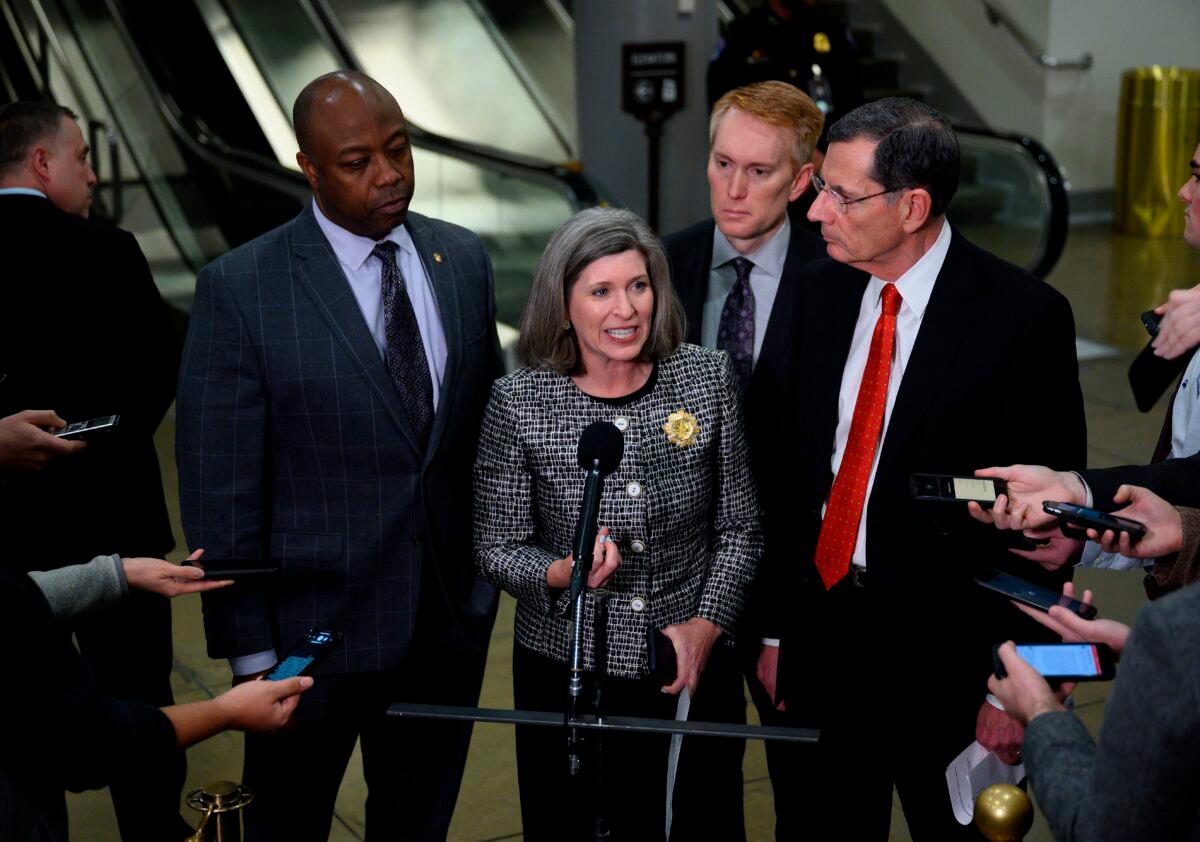 Sen. Joni Ernst (R-Iowa) (C) speaks as Sens. Tim Scott (R-S.C.) (L), James Lankford (R-Okla.) (2nd R) and John Barrasso (R-Wyo.) listen during a press conference during a break in the Senate impeachment trial of President Donald Trump at the U.S. Capitol in Washington on Jan. 23, 2020. (Andrew Caballero-Reynolds/AFP via Getty Images)
