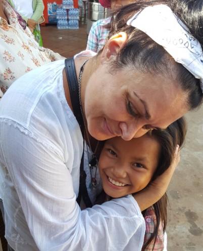 Kelly Galindo with a Cambodian child. (Courtesy of Kelly Galindo)
