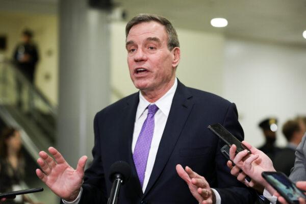 Sen. Mark Warner (R-Va.), then-vice chairman of the Senate Select Committee on Intelligence, speaks to media in the Senate subway area of the Capitol in Washington on Jan. 28, 2020. (Charlotte Cuthbertson/The Epoch Times)