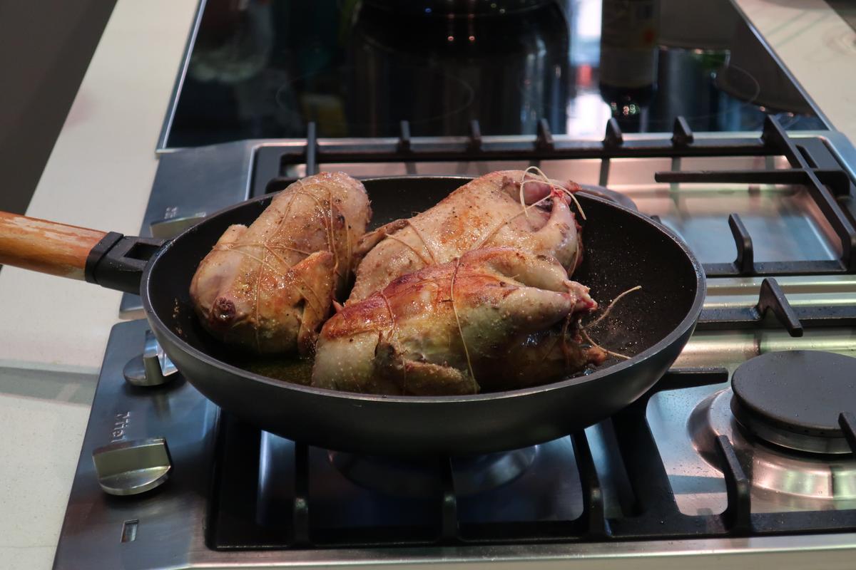 Browning the partridges before cooking them in a pressure cooker. (Kevin Revolinski)