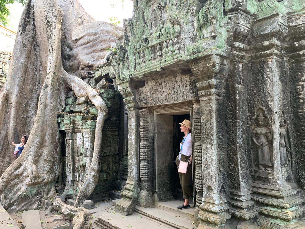 Trees have overtaken some temple buildings at Ta Prohm. (Janna Graber)
