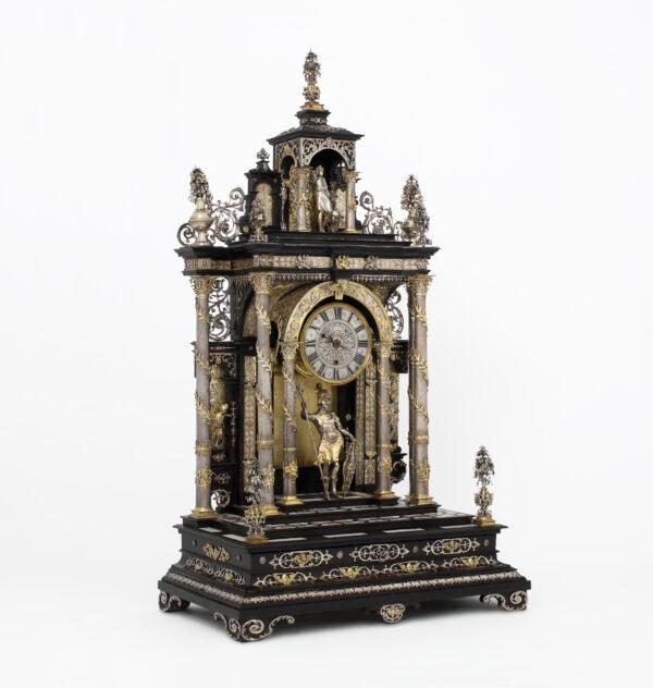 A 17th-century table clock, with elements assembled between 1880 and 1900, likely made by Matthias Walbaum in Augsburg, Germany. Silver-gilt, ebony and ivory; silver and gilded silver, ebonized wood inlaid with mother-of-pearl and ivory, glass. (Victoria and Albert Museum, London)