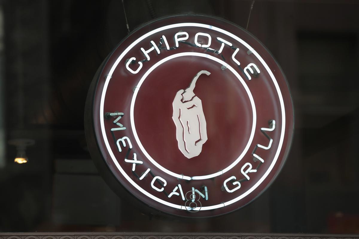 A sign marks the location of a Chipotle restaurant in a file photograph. (Scott Olson/Getty Images)