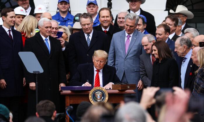 Trump Signs USMCA Trade Deal to End ‘NAFTA Nightmare’ in Major Policy Victory