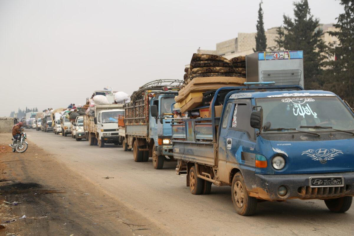 Trucks carry belongings of people fleeing from Maarat al-Numan in northern Idlib, Syria, on Dec. 24, 2019. (Mahmoud Hassano/File Photo/Reuters)