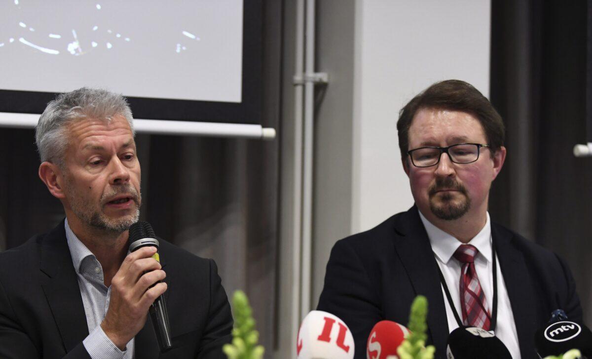 Chief Physician Taneli Puumalainen (L) and Director Mika Salminen of THL (National Institute for Health and Welfare) announce the first confirmed coronavirus case in Finland on Jan. 29, 2020. (Antti Aimo-Koivisto/AFP via Getty Images)