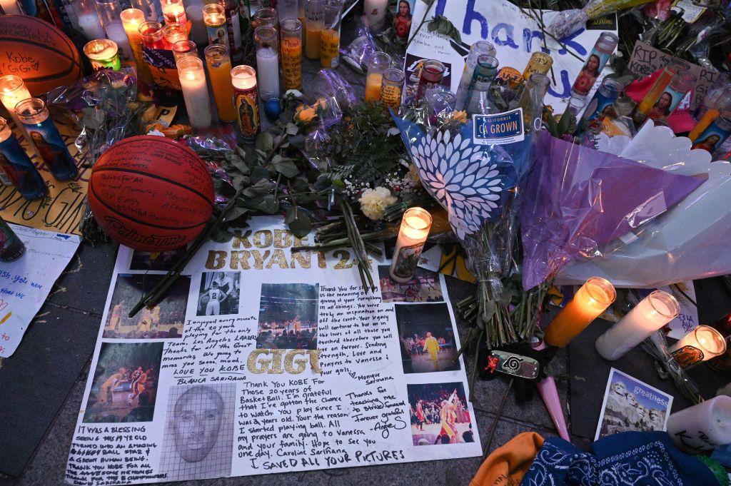 Notes, flowers, and candles placed at a makeshift memorial as fans mourn the death of the former NBA star outside Staples Center in Los Angeles on Jan. 29, 2020 (©Getty Images | <a href="https://www.gettyimages.com/detail/news-photo/notes-flowers-and-candles-are-placed-at-a-makeshift-news-photo/1197516931?adppopup=true">ROBYN BECK</a>)