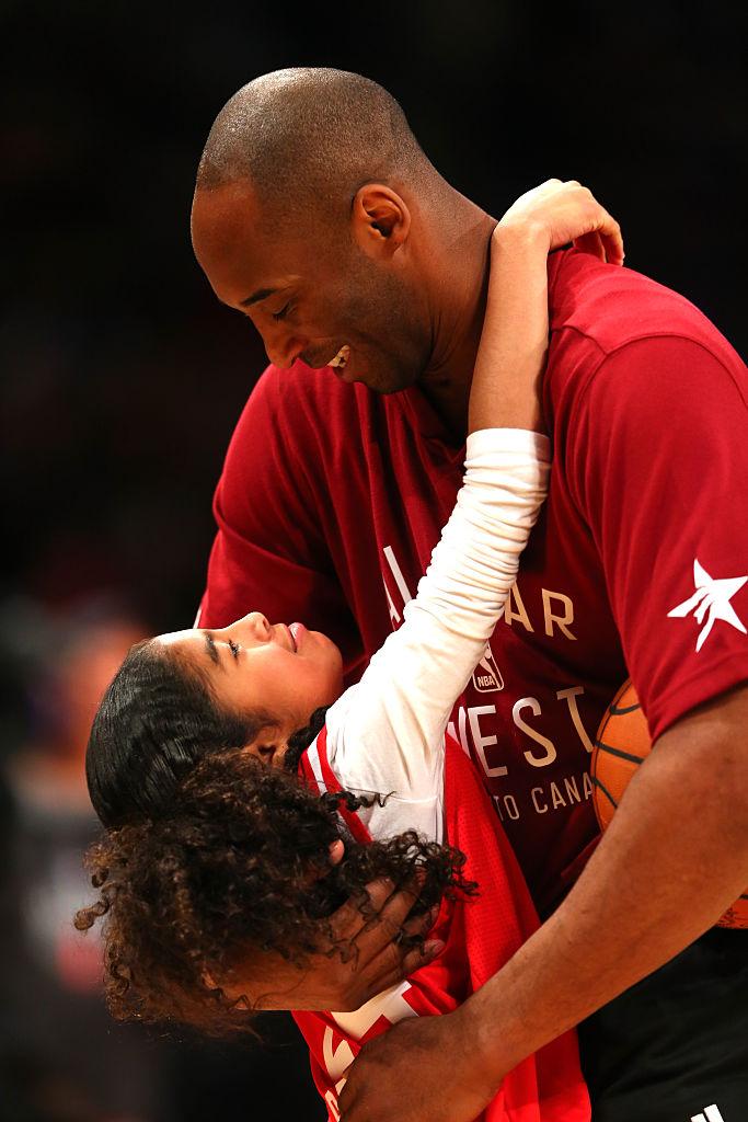 Kobe Bryant and daughter Gianna at the 2016 all-star game. (©Getty Images | <a href="https://www.gettyimages.com/detail/news-photo/kobe-bryant-of-the-los-angeles-lakers-and-the-western-news-photo/510293664?adppopup=true">Elsa</a>)