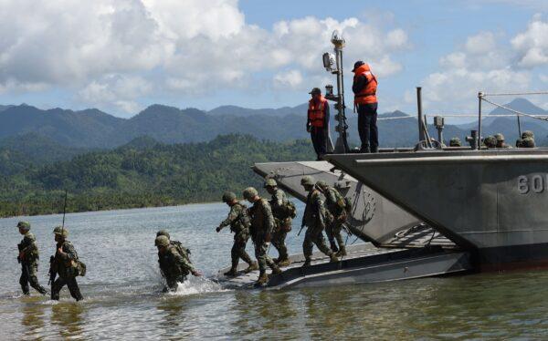 Philippine marines disembark from their landing ship as security responders during a simulation of a disaster drill as part of the annual joint Philippines-U.S. military exercise in Casiguran town, Aurora province, Philippines, on May 15, 2017. (Ted Aljibe/AFP via Getty Images)